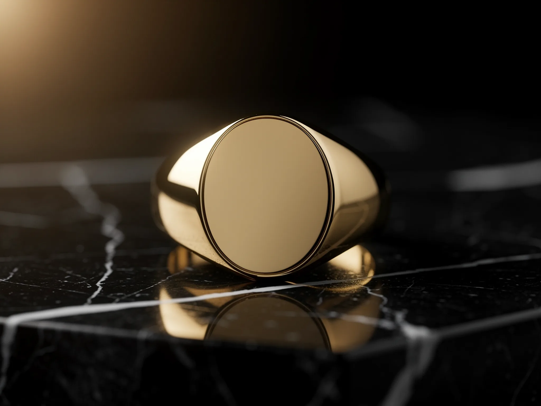 Signet Ring: A heavy gold signet ring on black marble.
